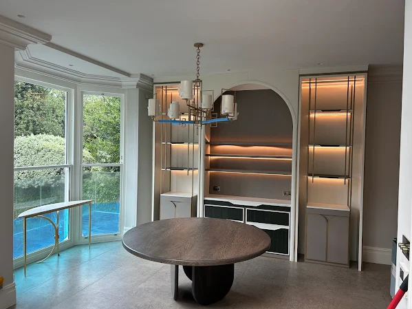 Built-in cabinetry and feature lighting with a refined finish